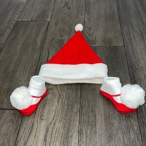 NWOT infant Santa hat with matching sock booties with pom-poms
